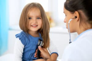 child getting heart rate checked by doctor